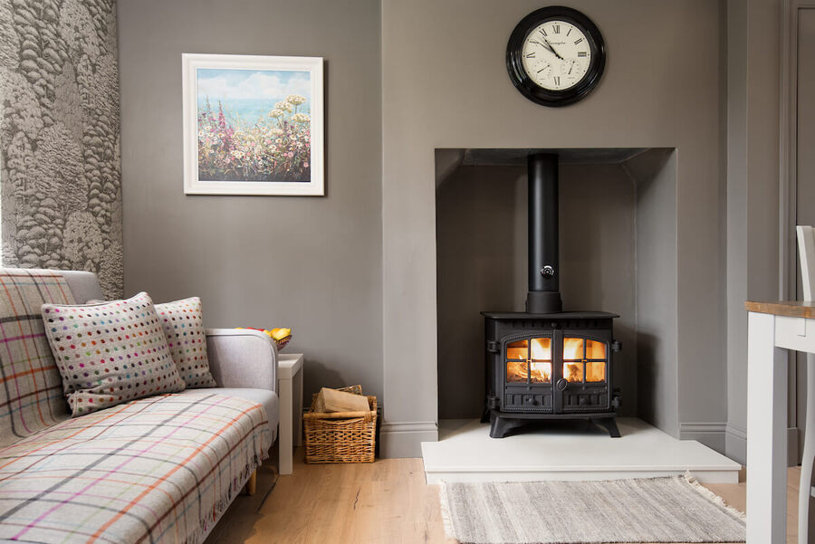 a dining room with log burner
